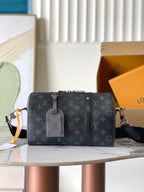 Louis Vuitton monogram crossbody bag with top zipper, shoulder strap, and luggage tag