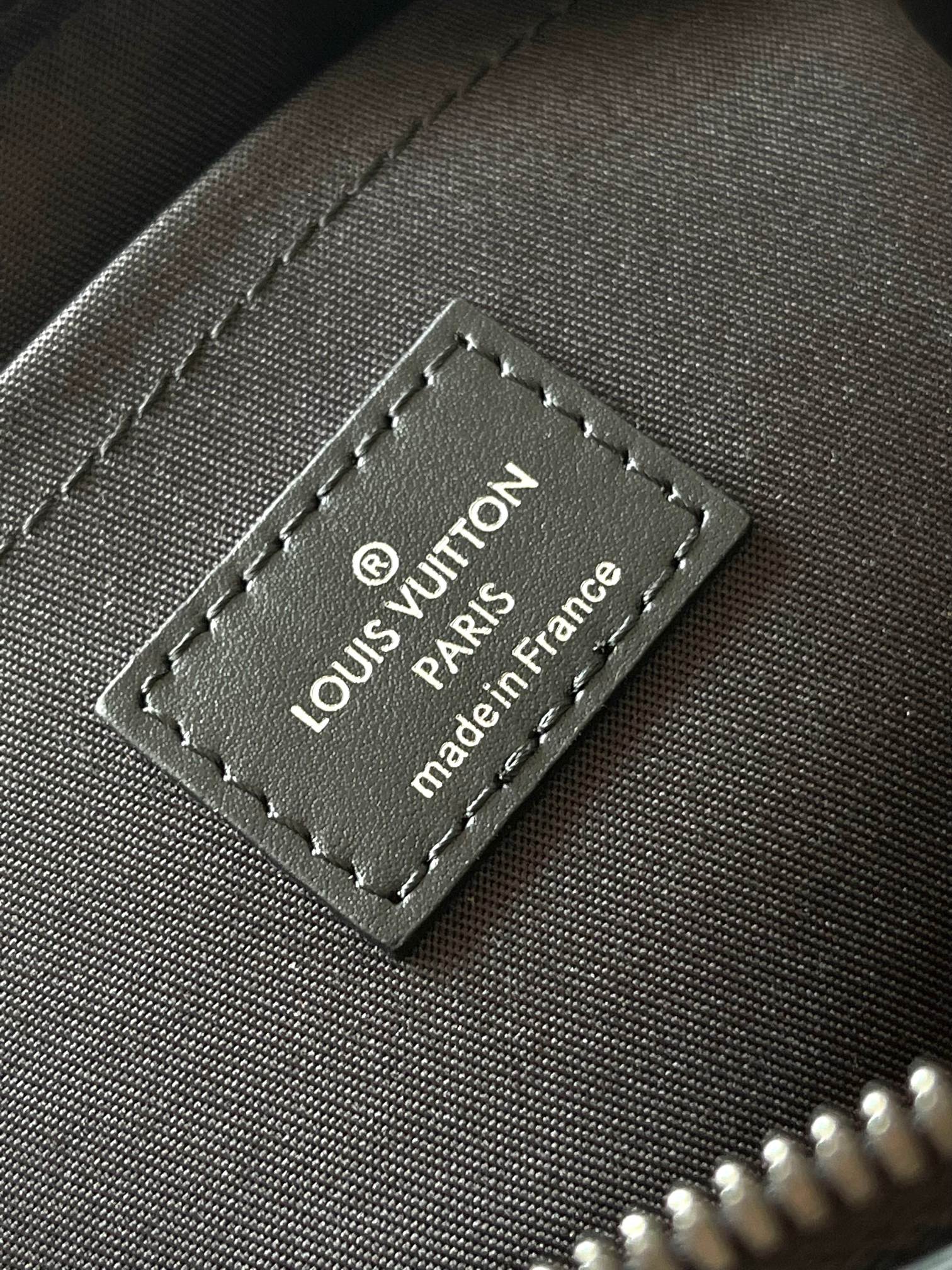 Louis Vuitton brand patch reading 'Louis Vuitton Paris' and 'made in France'