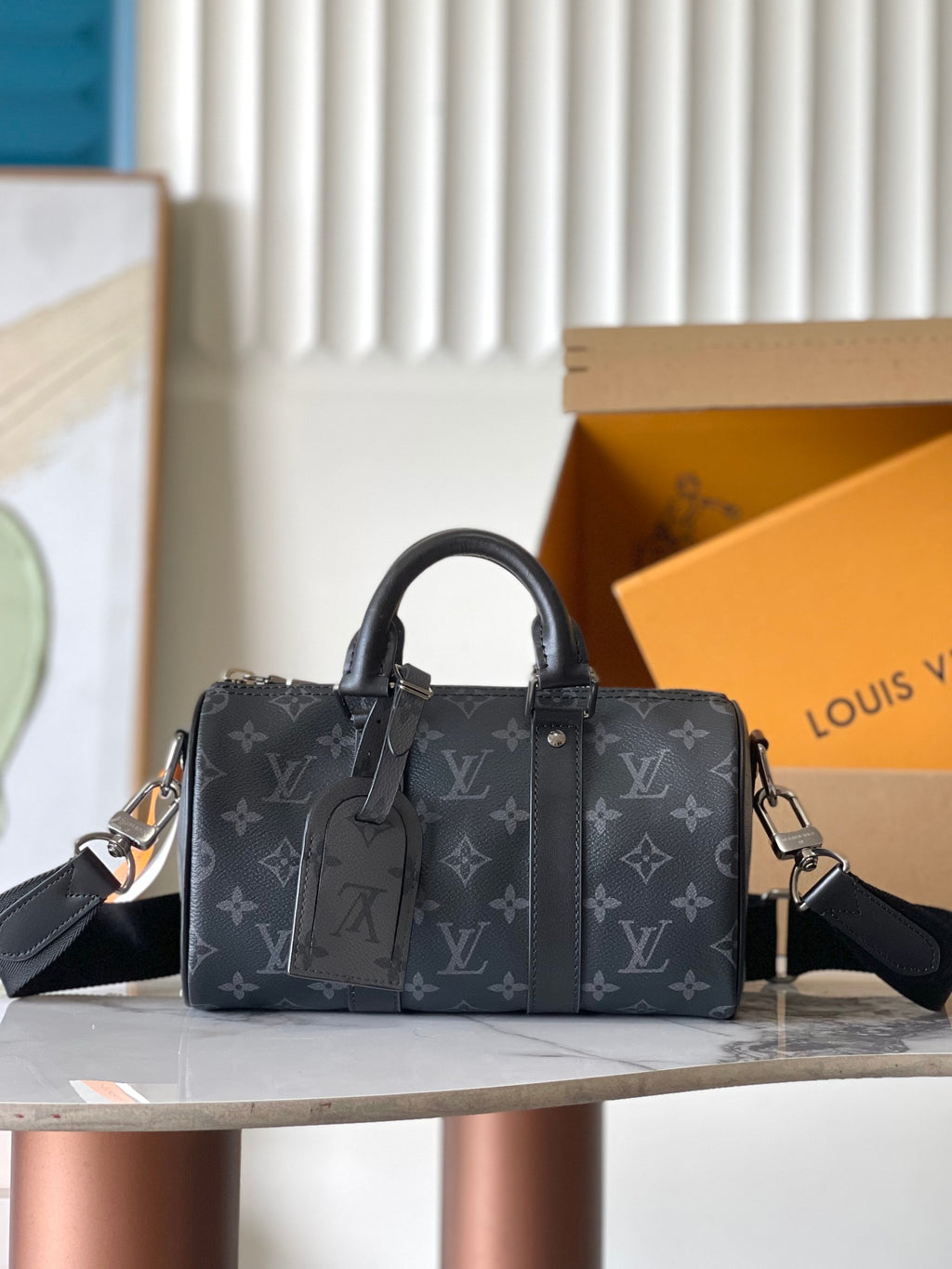 Louis Vuitton monogram top-handle handbag in dark gray with leather straps