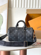 Louis Vuitton monogram top-handle handbag with adjustable shoulder strap and belt hardware