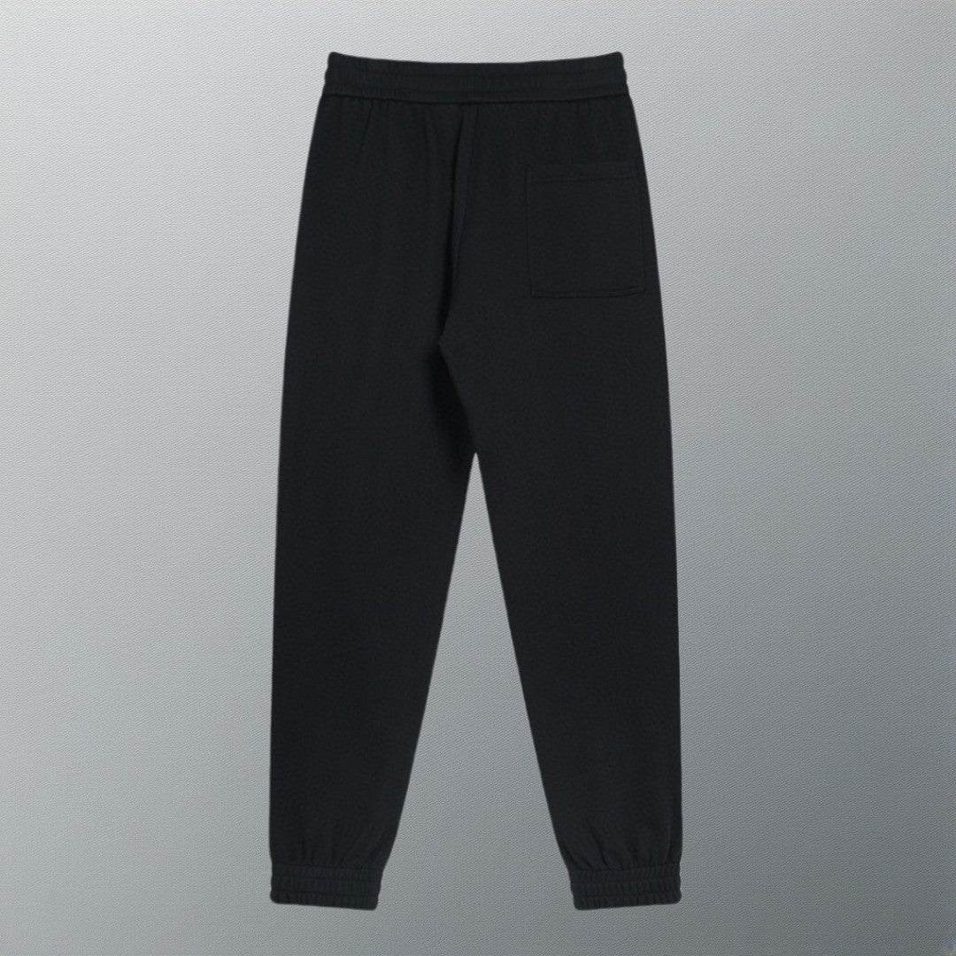 Black track pants with elastic waist and side pocket detail