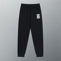 Black Burberry logo track pants with drawstring waist and ribbed cuffs