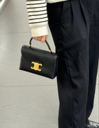 Celine black mini handbag with gold logo front flap and short top handles
