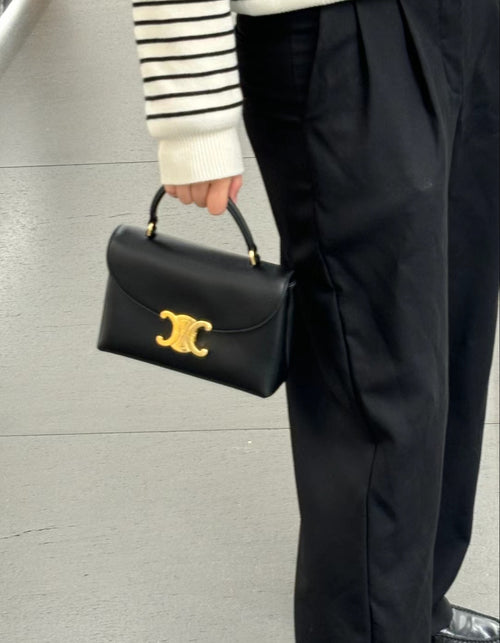 Celine black mini handbag with gold logo front flap and short top handles