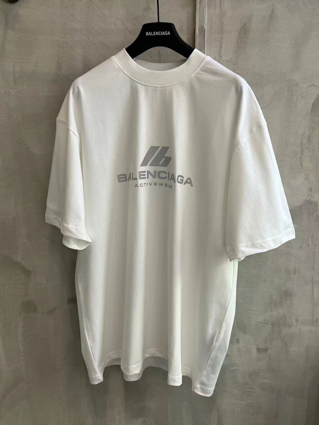 White short-sleeve T-shirt with Balenciaga logo on chest
