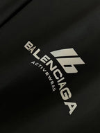 Black T-shirt close-up with Balenciaga Activewear logo print