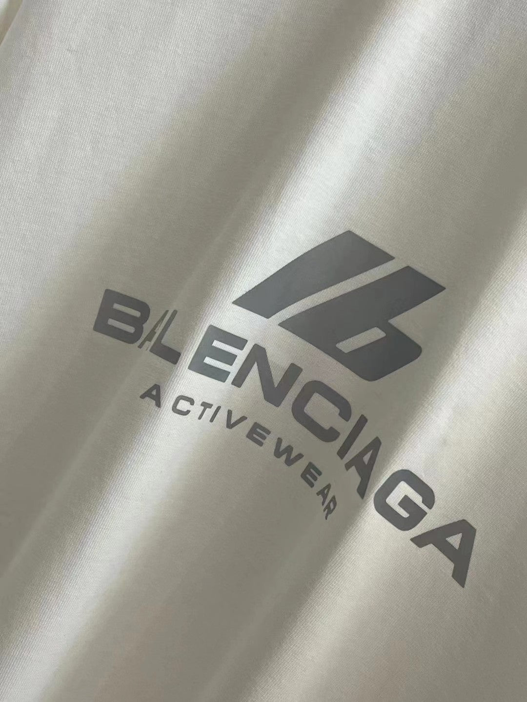 White T-shirt close-up with Balenciaga Activewear logo print