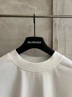 White crewneck T-shirt with Balenciaga label at collar