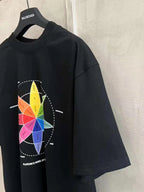 Black T-shirt with colorful wheel graphic, angled side view