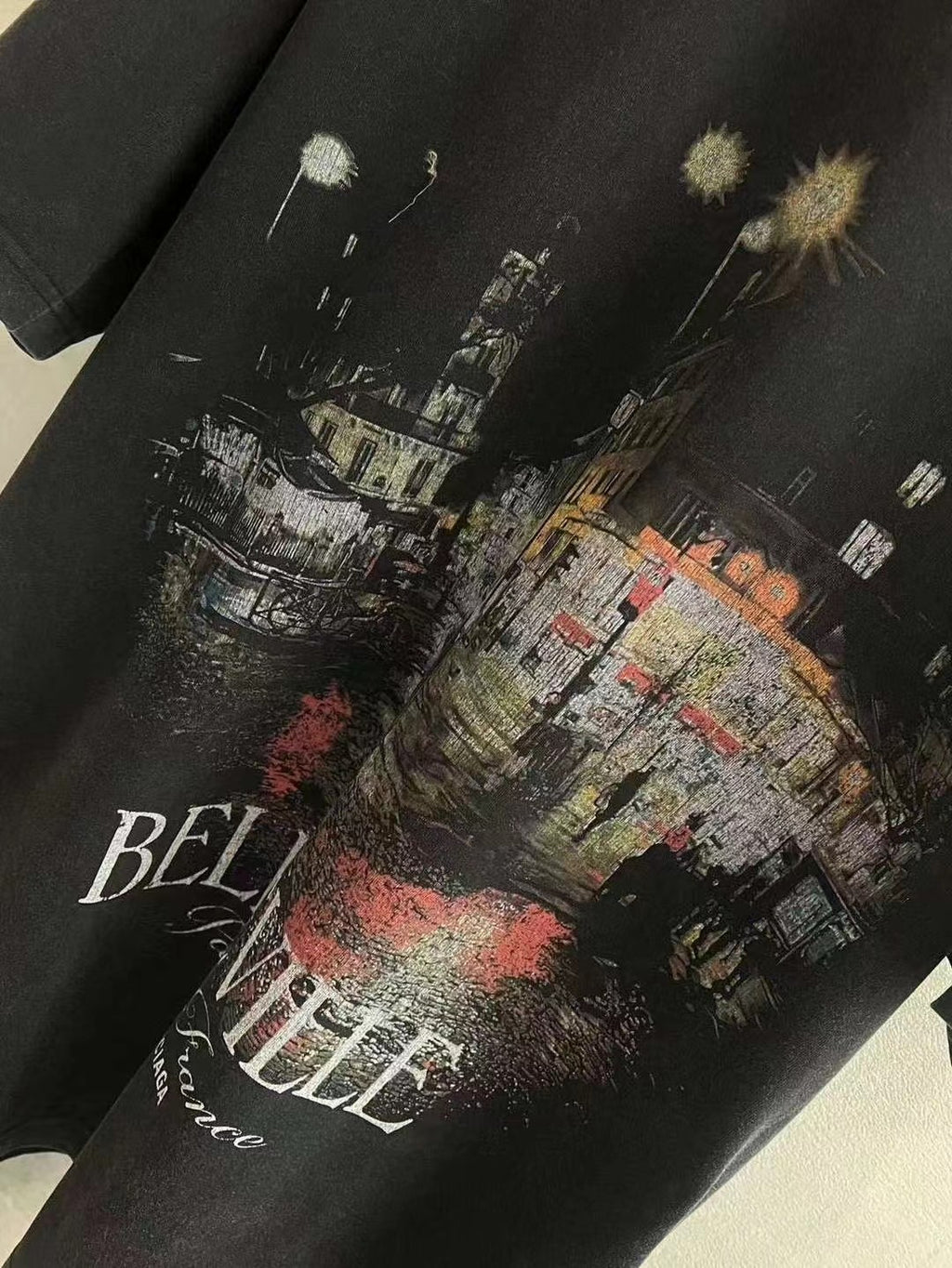Black Balenciaga T-shirt fabric close-up with “BELLEVILLE” city print