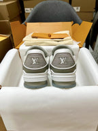 Louis Vuitton trainer sneakers, back view showing gray heel tops with LV embossed logos