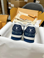 Louis Vuitton trainer shoes, back view with navy heels and LV logos
