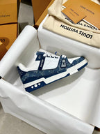 Louis Vuitton trainer shoes, side profile with navy heel and LV emblem