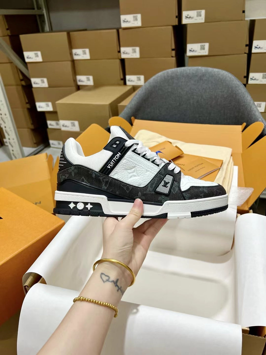 Low-top trainer sneakers, white and black leather with LV logo on side