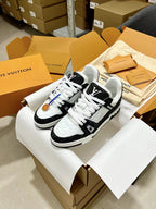 Low-top trainer sneakers in white and black with chunky sole and LV logo