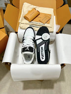 Low-top trainer sneakers in box, white and black with LV logo on heel and tongue