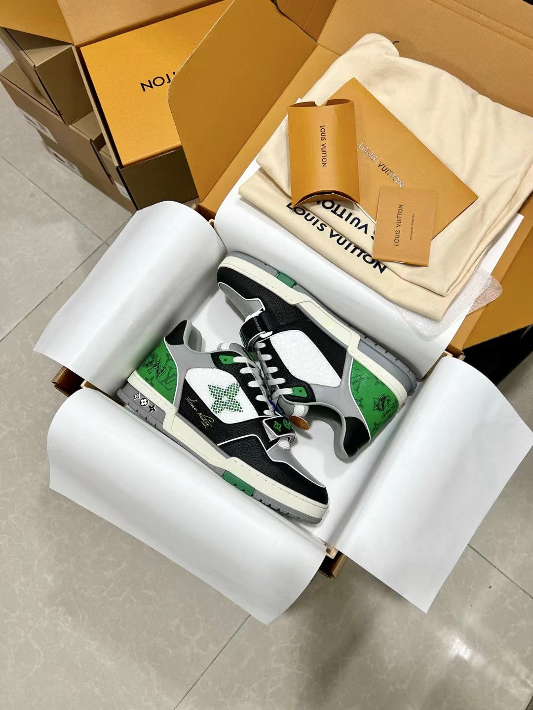 Louis Vuitton trainer sneakers, low-top black white with green side panels and lace-up