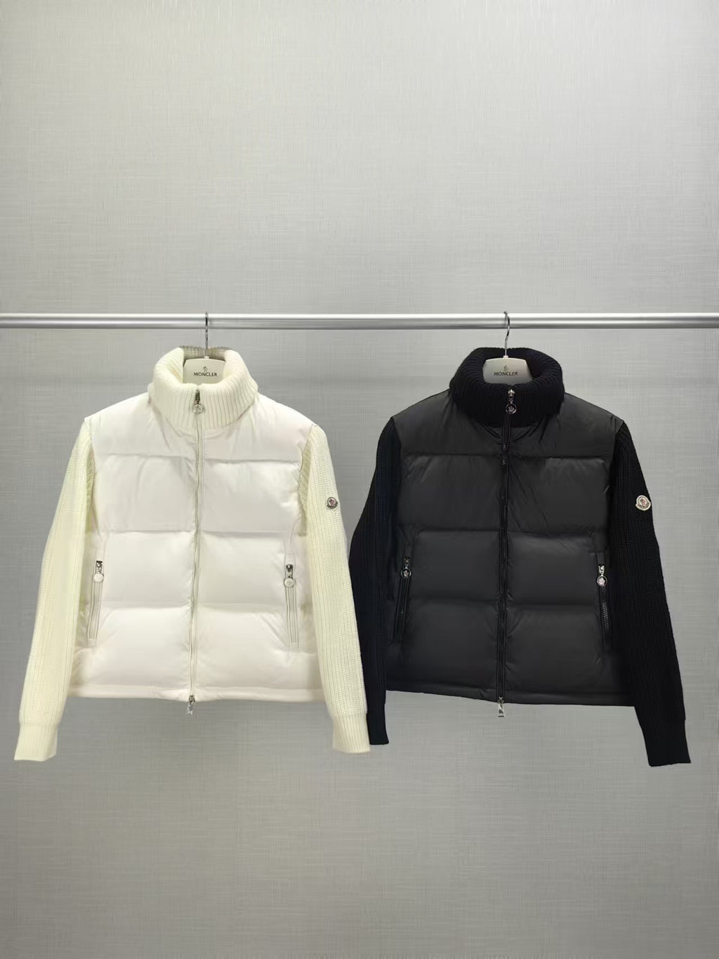 White and black long puffer jackets, zip-front with stand collar, side view