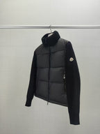 Long puffer jacket side view with knit sleeves, dark collar, front zip closure