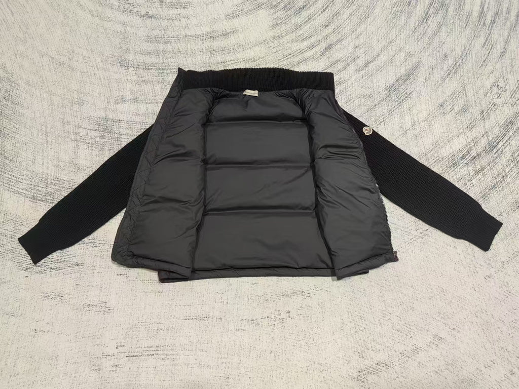 Long puffer jacket laid flat, stand collar, quilted interior panels and front zipper