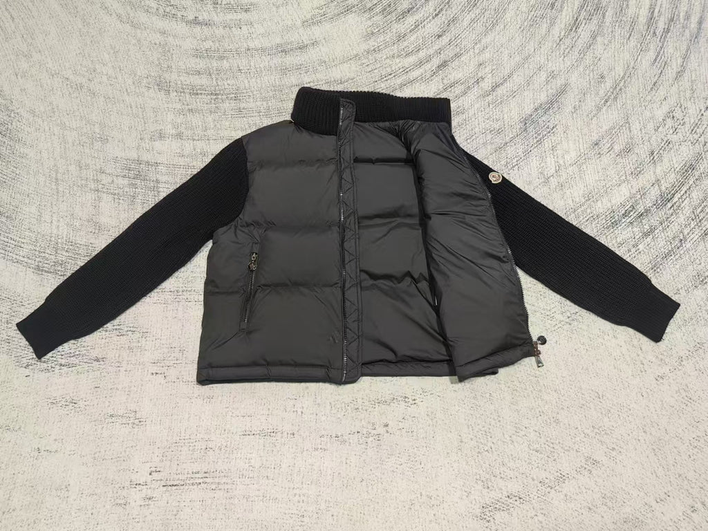 Long puffer jacket front view with stand collar, quilted panels, zipper and pocket zips