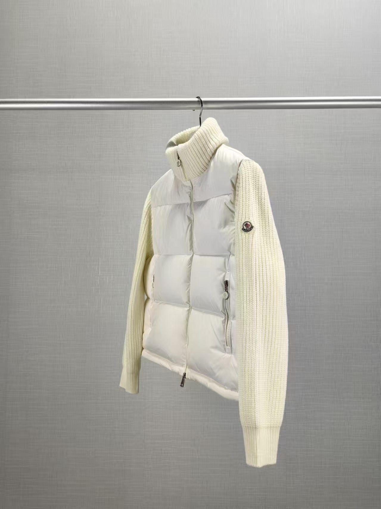 Long puffer jacket on hanger, knit cuffs, zip front, cream padded design