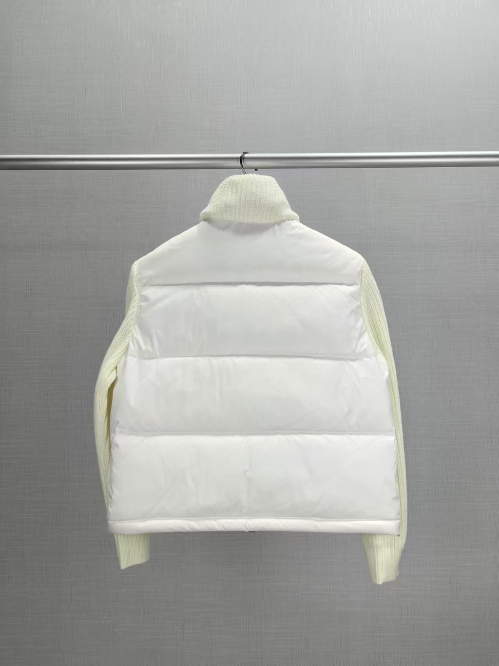Back view long puffer jacket, knit collar, cream padded front panels