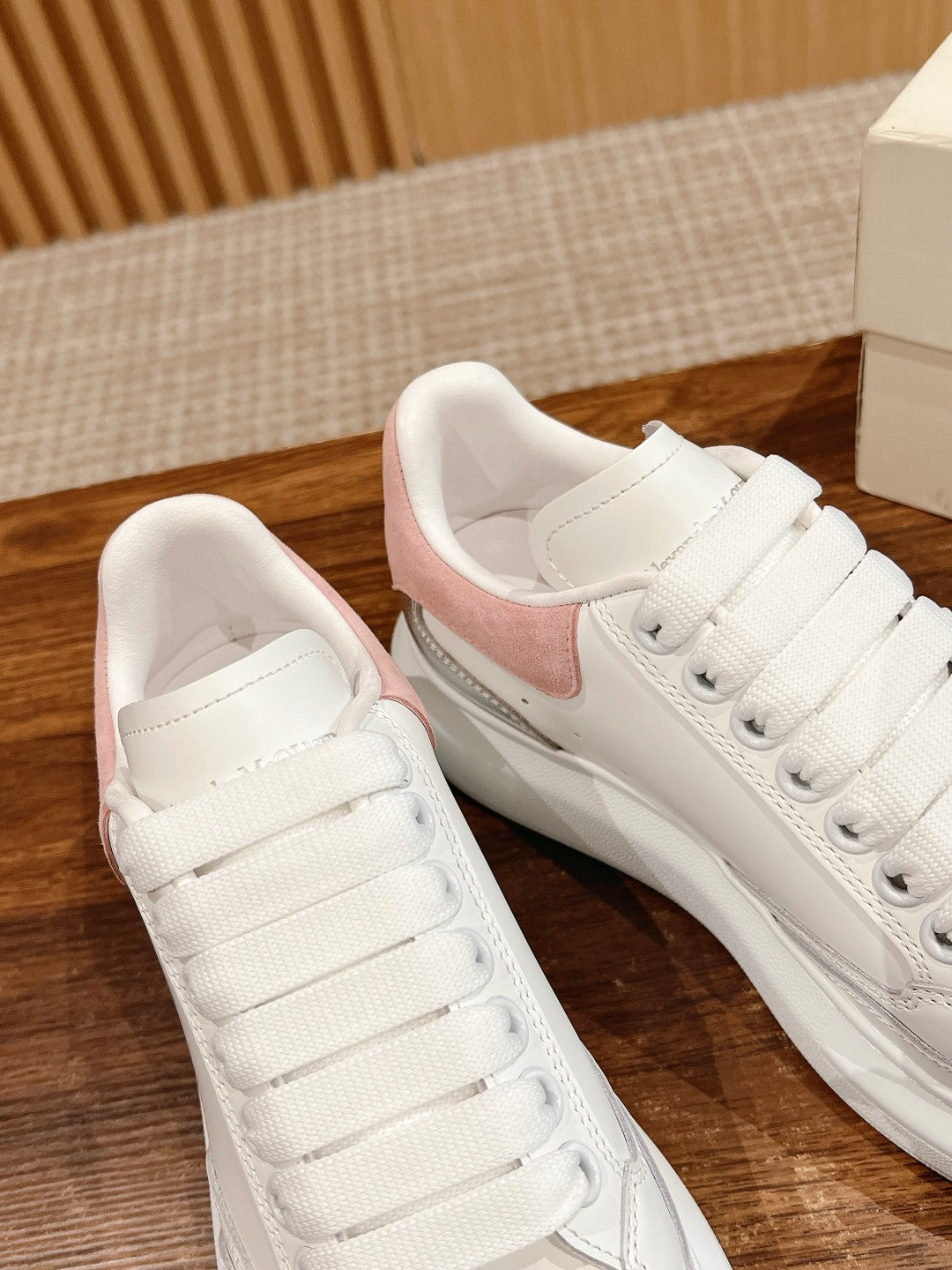 White lace-up sneakers with pink suede heel and gray toe/side panel