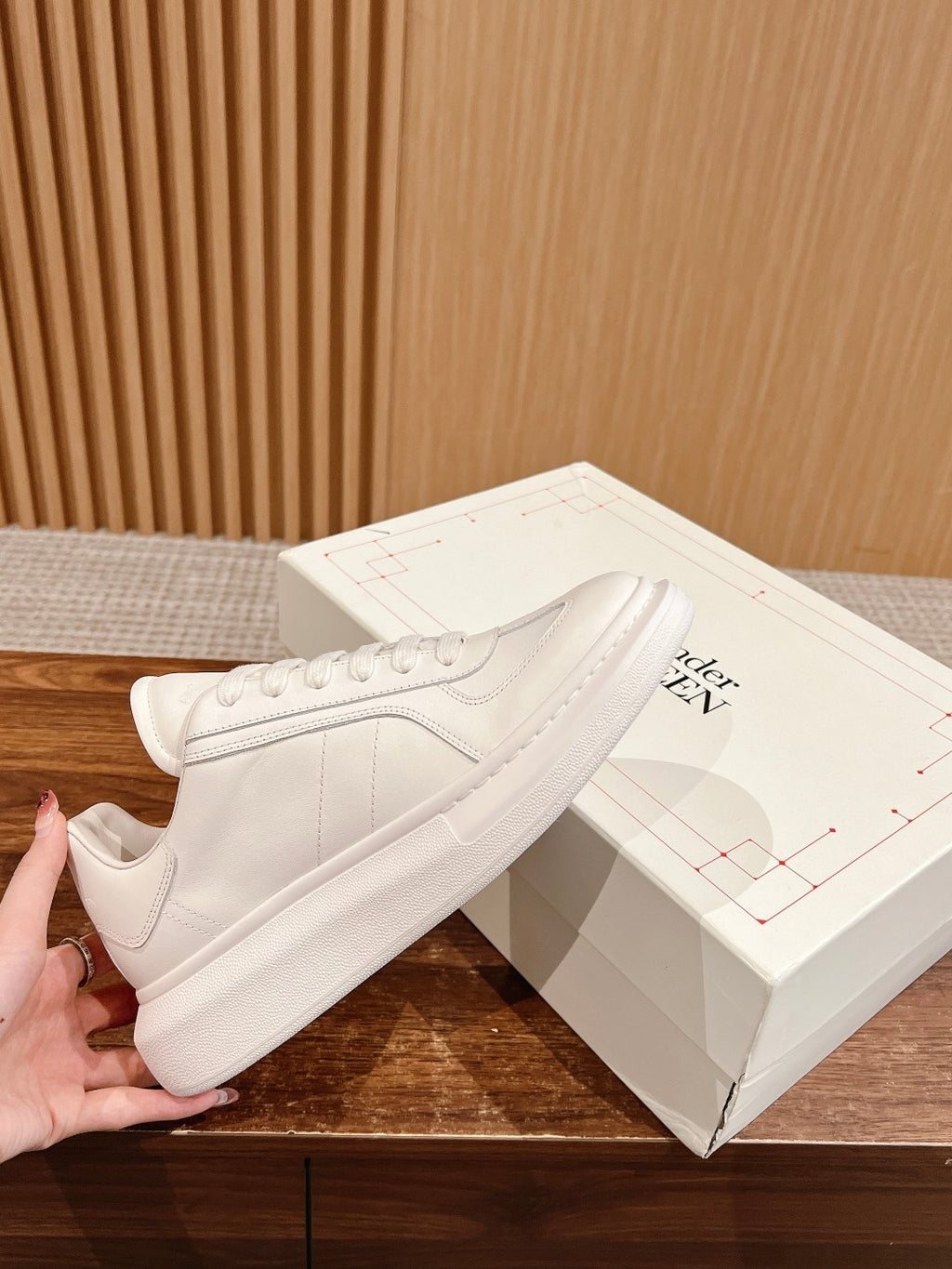 Alexander McQueen white leather sneakers with lace-up front and side panel detail