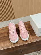 Pink lace-up sneakers pair with white midsoles