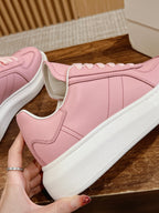 Pink Alexander McQueen sneakers, side panel detail with white rubber sole