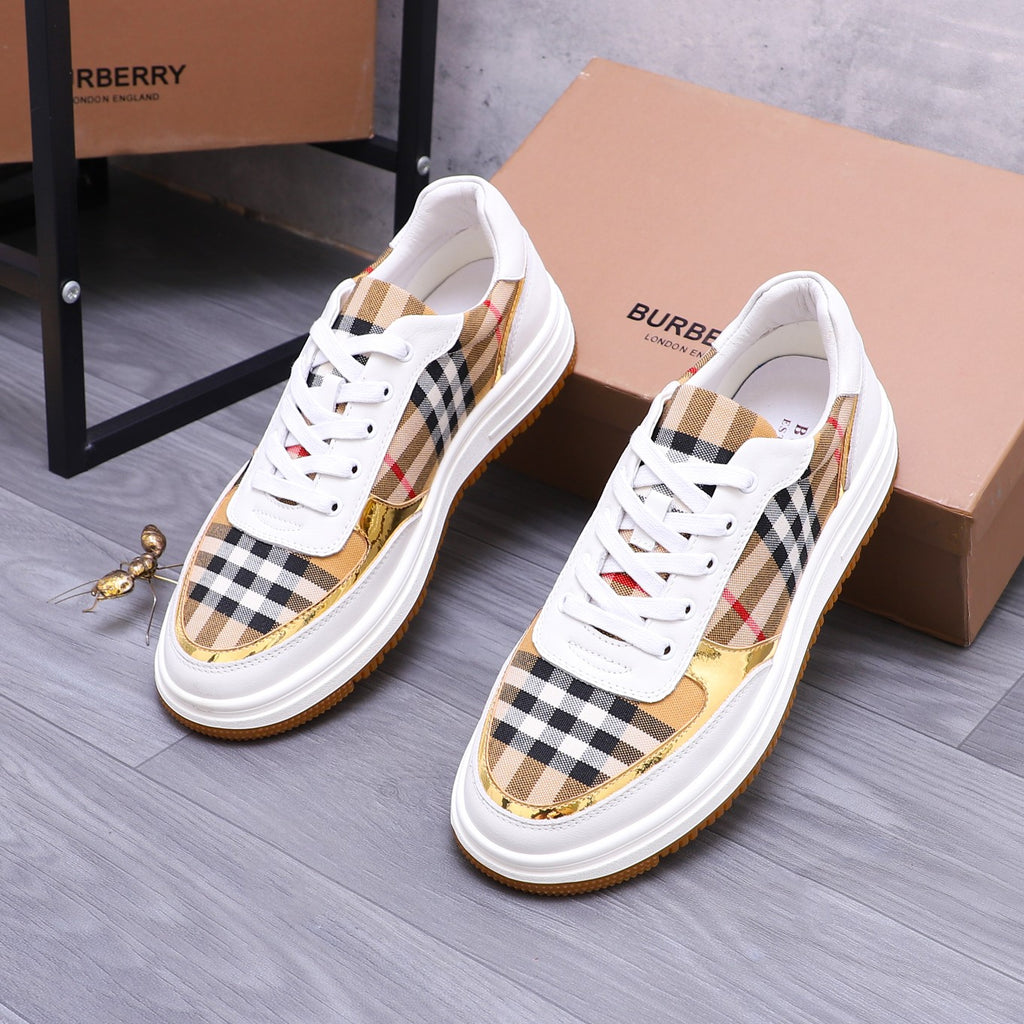White Burberry sneakers with check panel uppers, gold accents, and orange sole