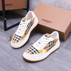 White Burberry sneakers with check panel uppers and orange rubber sole