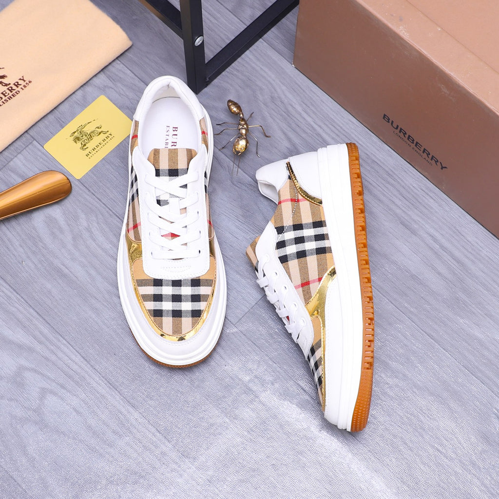 Pair of white Burberry sneakers with check uppers and orange textured side sole