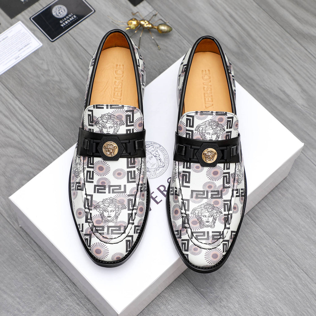 Versace patterned loafers with black strap and gold logo on white upper.