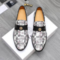 Versace patterned loafers with black strap and gold logo on white upper.