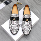 Versace patterned loafers with black strap and gold logo on white upper.