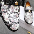 Versace loafer upper with black strap, gold medallion buckle, geometric Medusa print.