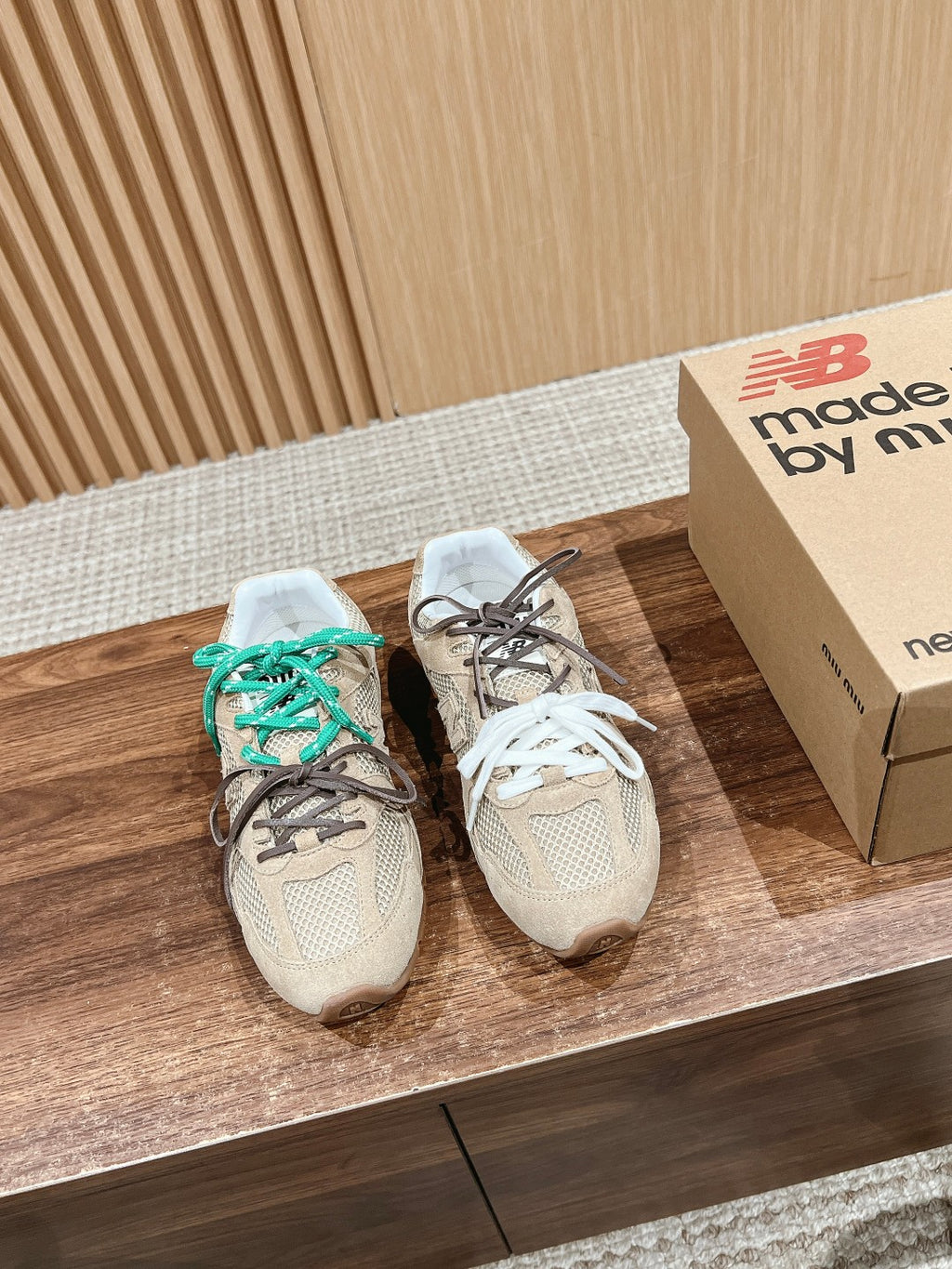 Prada unisex sneakers, beige uppers with teal-and-brown laces and white lace pair