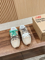Prada unisex sneakers, beige uppers with teal-and-brown laces and white lace pair