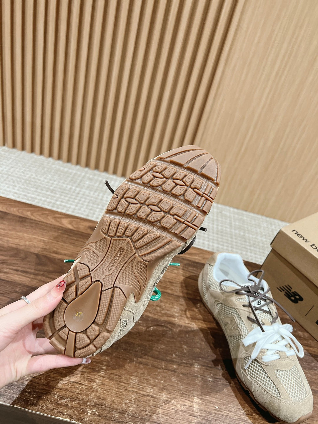 Prada unisex sneakers outsole view, beige sole with textured tread and teal laces