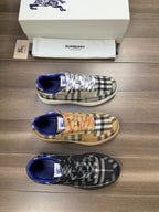 Burberry lace-up sneakers with black and navy check pattern, blue lining