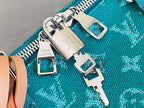Teal monogram bag zipper pulls with Louis Vuitton padlock hardware