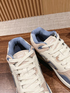 Dior unisex sneakers, pair view with Dior tongue tags and blue collar lining.