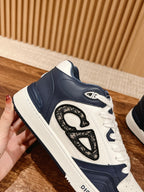 White-and-navy low-top sneakers with large Dior monogram on the side