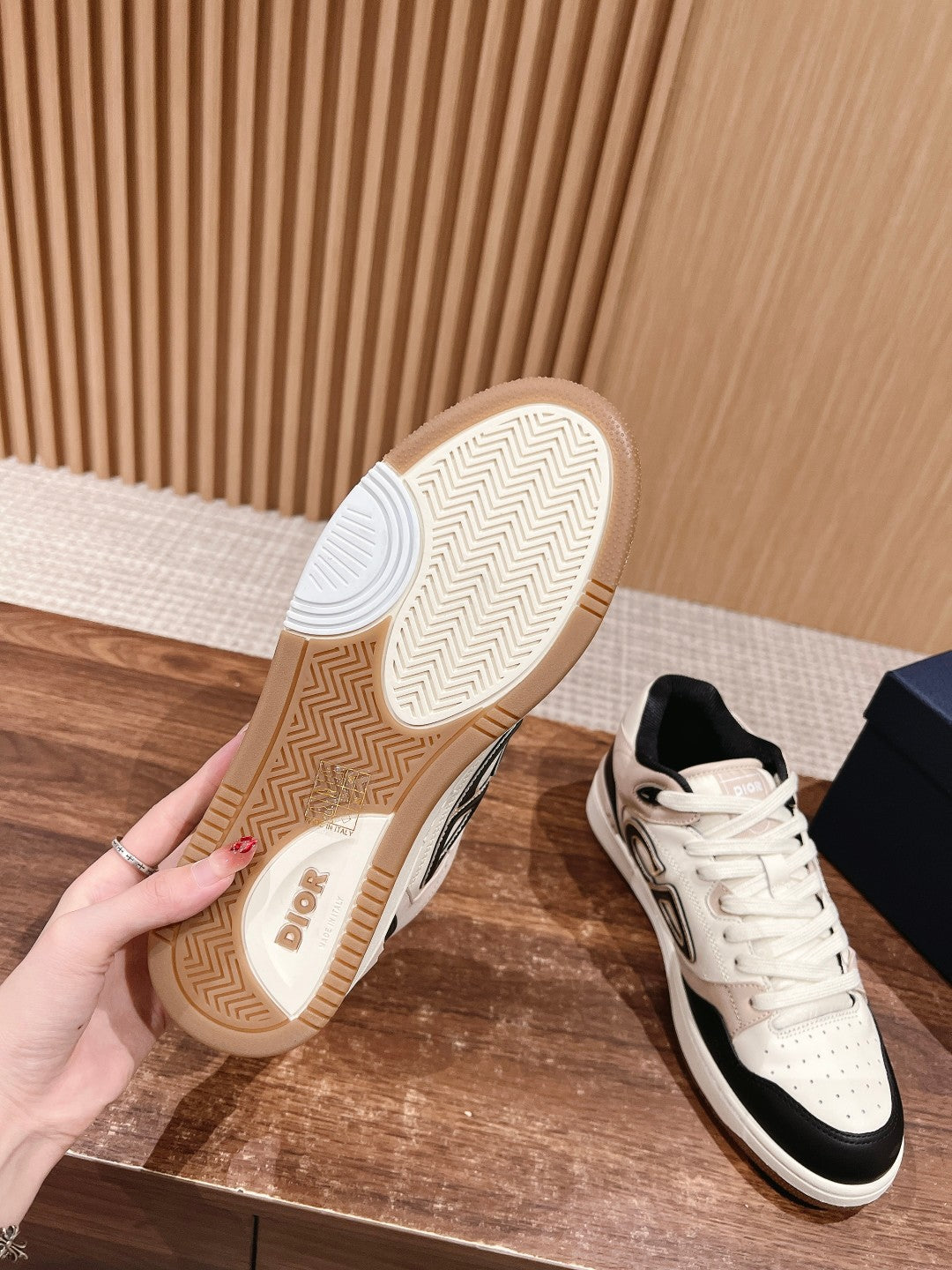 Unisex sneakers with cream soles; lace-up front and black accent side panels