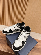 Dior unisex lace-up sneakers in white and black with side logo and cushioned collar