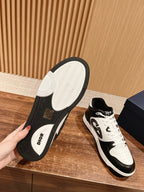 Dior unisex sneakers outsole view with tread and DIOR logo on black heel