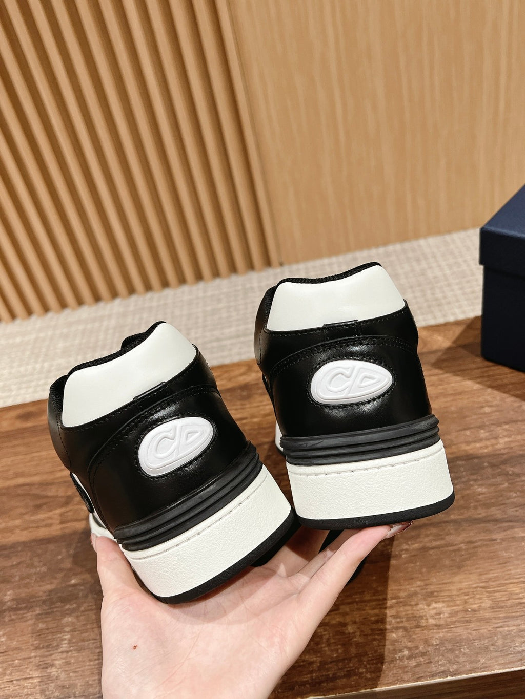 Dior unisex sneakers heels in black and white with oval logo on each heel