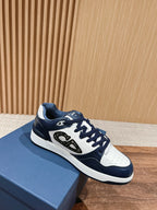 Navy and white low-top sneakers with swooping logo on the side